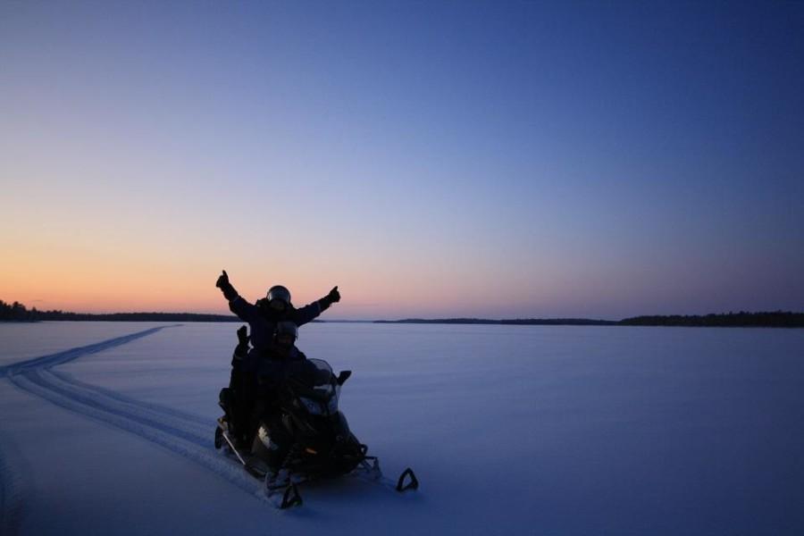 snowmobiling on lake inari