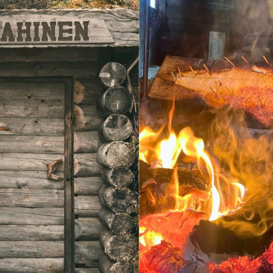 Vasemmalla on maalaismainen puumökki, jossa lukee ”MAAHINEN”; oikealla kalaa fileoidaan avotulella puulevyn päällä.